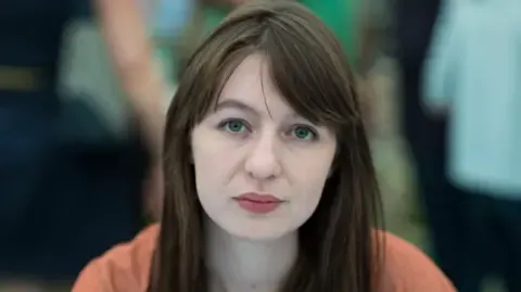 Irish author Sally Rooney claims she cannot travel to the UK because of arrest fears